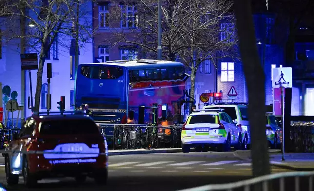 A double-decker bus crashed into a bus shelter in Stockholm on Friday, Nov. 14, 2025, causing fatalities and injuries. (Henrik Montgomery/TT News Agency via AP)
