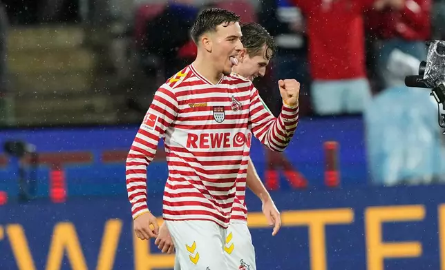 Cologne's Said El Mala celebrates after scoring his side's third goal during the German Bundesliga soccer match between Cologne and Hamburger SV, in Cologne, Germany, Sunday, Nov. 2, 2025. (AP Photo/Martin Meissner)