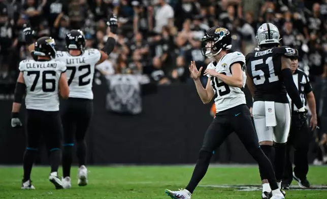 Jacksonville Jaguars place kicker Cam Little (39) reacts after making a 68-yard field goal during the first half of an NFL football game against the Las Vegas Raiders, Sunday, Nov. 2, 2025, in Las Vegas. (AP Photo/David Becker)