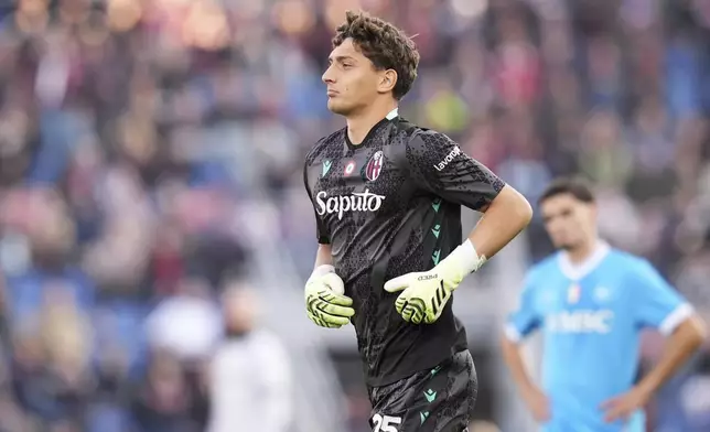 Bologna's goalkeeper Massimo Pessina enters the field during a Serie A soccer match between Bologna and Napoli, in Bologna, northern Italy, Sunday, Nov. 9, 2025. (Massimo Paolone/LaPresse via AP)