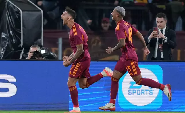 Roma's Lorenzo Pellegrini, left, celebrates after scoring during the Serie A soccer match between Roma and Udinese, in Rome, Sunday, Nov. 9, 2025. (Alfredo Falcone/LaPresse via AP)