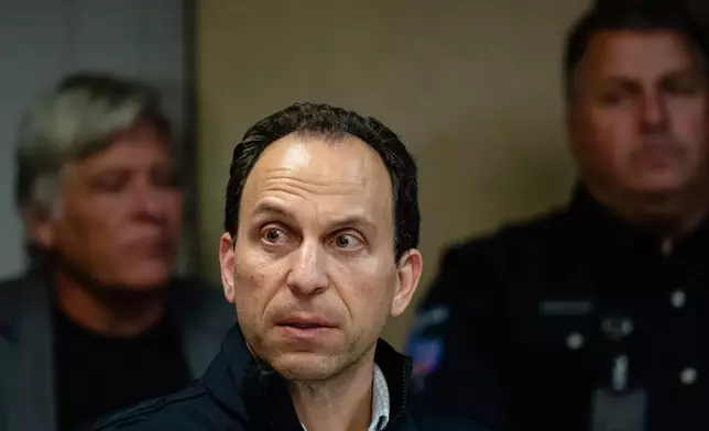 CORRECTS FLIGHT NUMBER Mayor Craig Greenberg speaks at Louisville Regional Airport Authority about the crash of UPS Flight 2976 at Louisville Muhammad Ali International Airport on Tuesday, Nov. 4, 2025, in Louisville, Ky. (AP Photo/Jon Cherry)