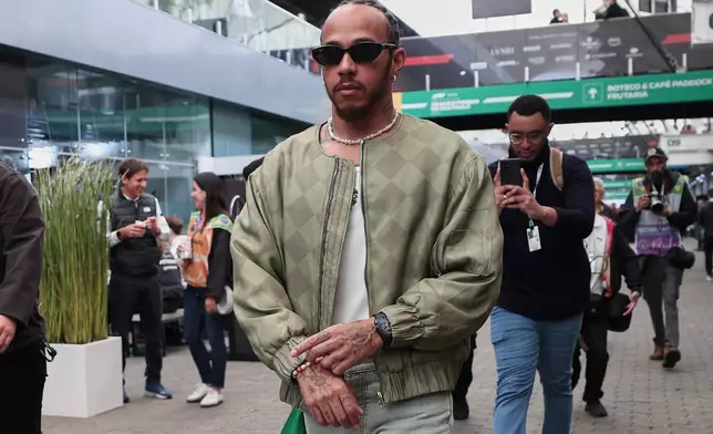Ferrari driver Lewis Hamilton of Britain, arrives at the Interlagos race track ahead of the Brazilian Formula One Grand Prix in Sao Paulo, Sunday, Nov. 9, 2025. (AP Photo/Ettore Chiereguini)
