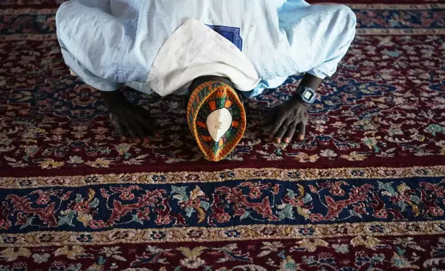 Idris Ishaq, an imam who said he’s lost his grandson, cousin and elder brother in different attacks since 2022, prays at the central mosque in Kaduna, northwestern Nigeria, Nov. 6, 2025. (AP Photo/Sunday Alamba)