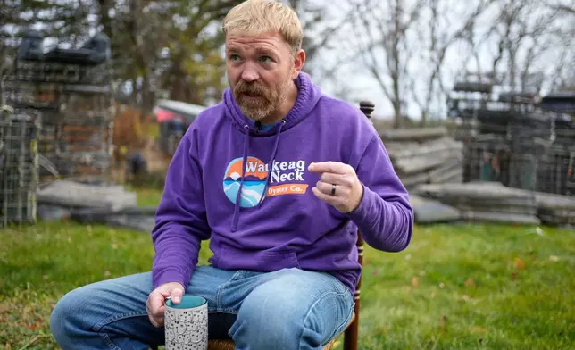 Graham Platner, Democratic candidate for U.S. Senate, speaks to a reporter at his home, Monday, Nov. 3, 2025, in Sullivan, Maine. (AP Photo/Robert F. Bukaty)
