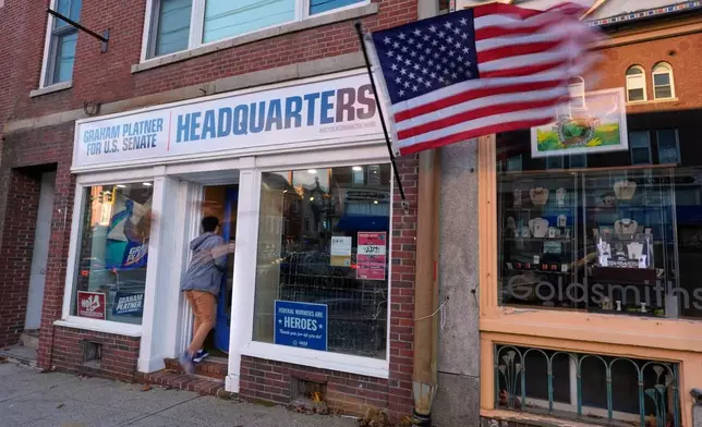 A worker enters the campaign headquarters for US Senate candidate Graham Platner, Tuesday, Nov. 4, 2025, in Ellsworth, Maine. (AP Photo/Robert F. Bukaty)