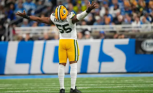 Green Bay Packers defensive lineman Kingsley Enagbare (55) celebrates a sack against the Detroit Lions during the first half an NFL football game in Detroit, Thursday, Nov. 27, 2025. (AP Photo/Ryan Sun)