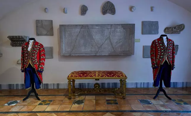 Ceremonial uniforms worn by palace staff are displayed in the prince's apartments at Palazzo Colonna, or the Colonna Palace, in Rome during a media tour, Friday, Nov. 7, 2025. (AP Photo/Domenico Stinellis)