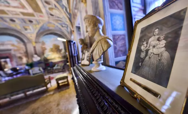 A photograph of Milagros, Marcantonio and Laurentia Colonna is on display inside the prince's apartments at Palazzo Colonna, or the Colonna Palace, in Rome during a media tour, Friday, Nov. 7, 2025. (AP Photo/Domenico Stinellis)