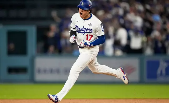 FILE - Los Angeles Dodgers' Shohei Ohtani celebrates his home run against the Toronto Blue Jays during the seventh inning in Game 3 of baseball's World Series, Monday, Oct. 27, 2025, in Los Angeles. (AP Photo/Brynn Anderson, File)