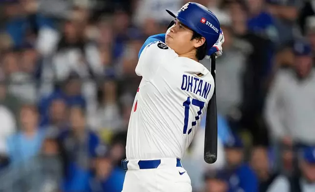 FILE - Los Angeles Dodgers' Shohei Ohtani watches his home run against the Toronto Blue Jays during the seventh inning in Game 3 of baseball's World Series, Monday, Oct. 27, 2025, in Los Angeles. (AP Photo/Brynn Anderson, File)