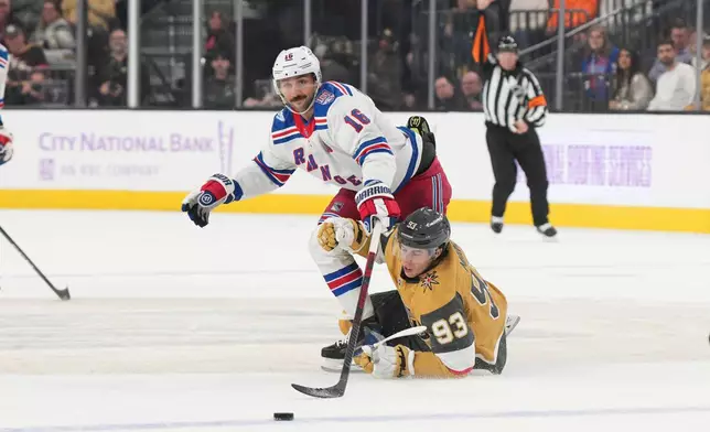 New York Rangers center Vincent Trocheck (16) trips Vegas Golden Knights right wing Mitch Marner (93) in the first period of an NHL hockey game Tuesday, Nov. 18, 2025, in Las Vegas. (AP Photo/Candice Ward)