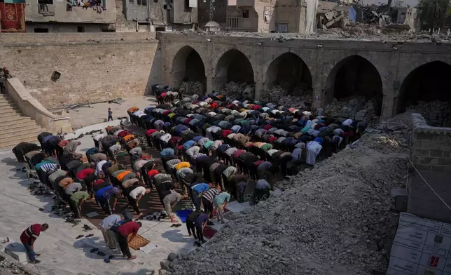 Palestinians attend Friday prayers at the Omari Mosque in Gaza's Old City Friday, Nov. 7, 2025. (AP Photo/Jehad Alshrafi)