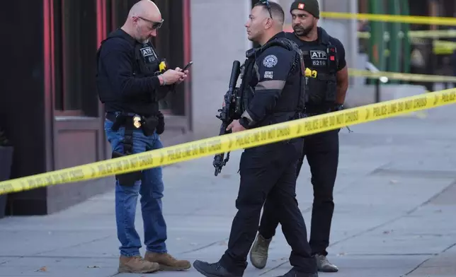 ATF and Secret Service Police officers are seen after reports of two National Guard soldiers shot near the White House in Washington, Wednesday, Nov. 26, 2025. (AP Photo/Evan Vucci)