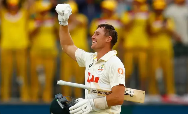 Australia's Marnus Labuschagne celebrates after Australia won the first Ashes cricket test match against England in Perth, Saturday, Nov. 22, 2025.(AP Photo/Gary Day)