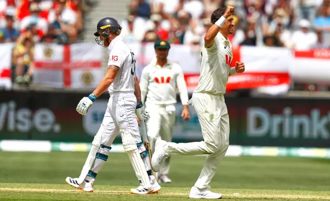 Australia's Mitchell Starc celebrates the wicket of England's captain Ben Stokes, left, on day two of the first Ashes cricket test match between Australia and England in Perth, Saturday, Nov. 22, 2025.(AP Photo/Gary Day)