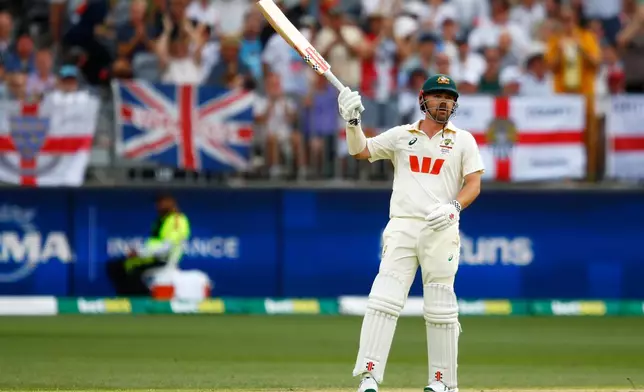 Australia's Travis Head reacts after completing his fifty runs on day two of the first Ashes cricket test match between Australia and England in Perth, Saturday, Nov. 22, 2025.(AP Photo/Gary Day)