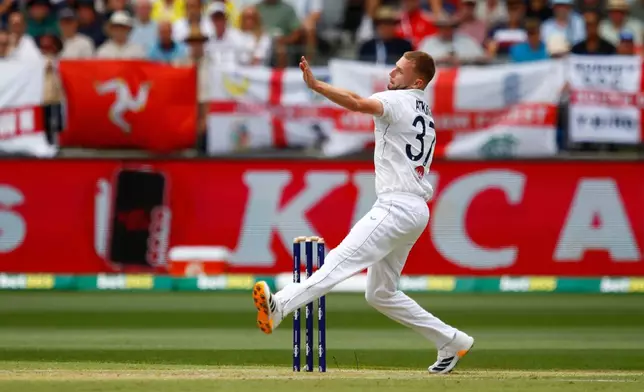 England's Gus Atkinson bowls a delivery on day two of the first Ashes cricket test match between Australia and England in Perth, Saturday, Nov. 22, 2025.(AP Photo/Gary Day)