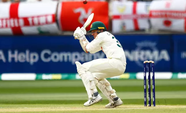 Australia's Brendan Doggett ducks a bouncer on day two of the first Ashes cricket test match between Australia and England in Perth, Saturday, Nov. 22, 2025.(AP Photo/Gary Day)