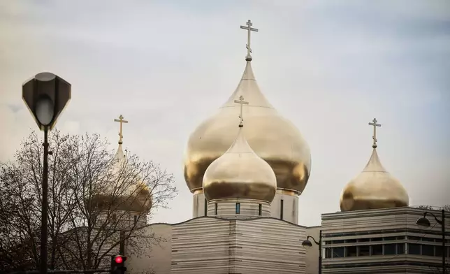 Parts of the Holy-Trinity Russian orthodox Cathedral and the adjoining culture center, right, are seen in Paris, Wednesday, Nov. 26, 2025. (AP Photo/Thomas Padilla)