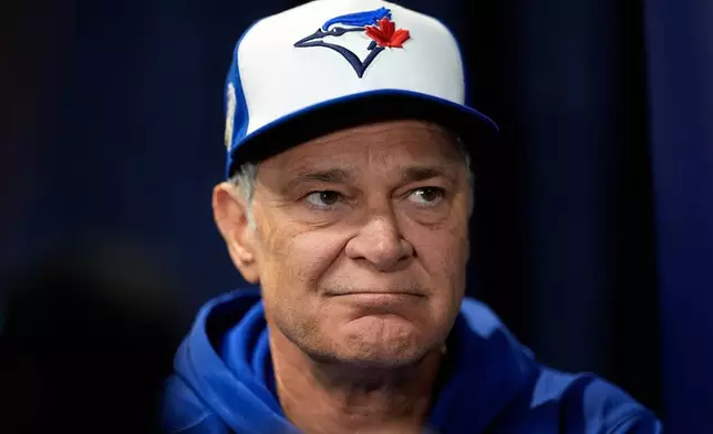 FILE - Toronto Blue Jays bench coach Don Mattingly speaks during a World Series baseball media day, Thursday, Oct. 23, 2025, in Toronto. (AP Photo/David J. Phillip, file)