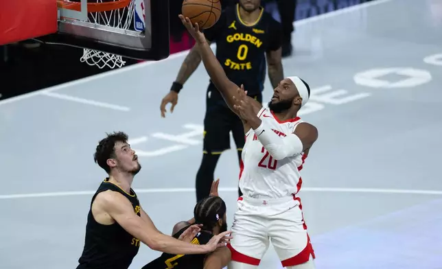 Houston Rockets guard Josh Okogie shoots during the first half of an Emirates NBA Cup basketball game against the Golden State Warriors, Wednesday, Nov. 26, 2025, in San Francisco. (AP Photo/Benjamin Fanjoy)