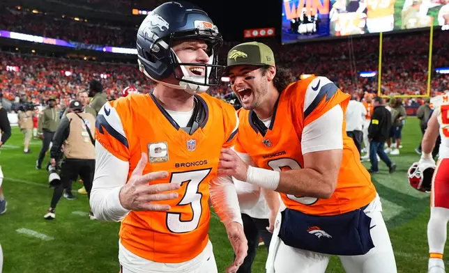 Denver Broncos place kicker Wil Lutz (3) is congratulated by teammate Jarrett Stidham, right, after celebrates making a 35-yard field goal to defeat the Kansas City Chiefs in an NFL football game Sunday, Nov. 16, 2025, in Denver. (AP Photo/Jack Dempsey)