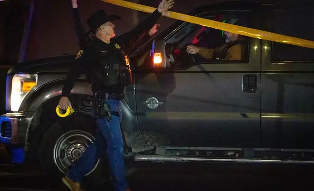 First responders at scene of a mass shooting Saturday, Nov. 29, 2025, in Stockton, Calif. (AP Photo/Ethan Swope)
