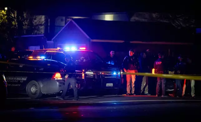 First responders at scene of a mass shooting Saturday, Nov. 29, 2025, in Stockton, Calif. (AP Photo/Ethan Swope)