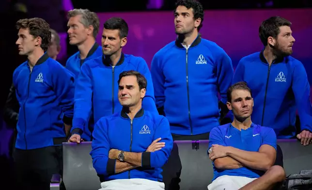 FILE - An emotional Roger Federer, left, of Team Europe sits alongside his playing partner, Rafael Nadal, after their Laver Cup doubles match against Team World's Jack Sock and Frances Tiafoe in London, Sept. 23, 2022. (AP Photo/Kin Cheung, File)