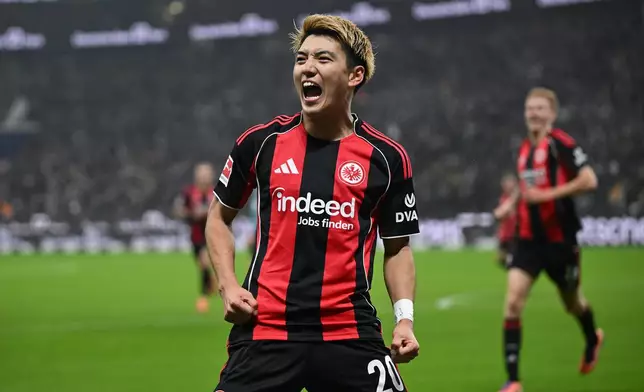 Frankfurt's Ritsu Doan celebrates after scoring during the German Bundesliga soccer match between Eintracht Frankfurt and FSV Mainz 05 in Frankfurt, Germany, Sunday, Nov. 9, 2025. (Arne Dedert/dpa via AP)