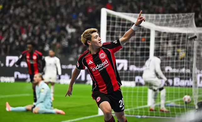 Frankfurt's Ritsu Doan celebrates after scoring during the German Bundesliga soccer match between Eintracht Frankfurt and FSV Mainz 05 in Frankfurt, Germany, Sunday, Nov. 9, 2025. (Arne Dedert/dpa via AP)