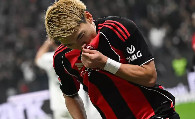Frankfurt's Ritsu Doan celebrates after scoring during the German Bundesliga soccer match between Eintracht Frankfurt and FSV Mainz 05 in Frankfurt, Germany, Sunday, Nov. 9, 2025. (Arne Dedert/dpa via AP)