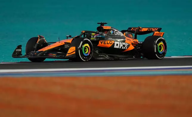McLaren driver Oscar Piastri of Australia steers his car during the first qualifying session at the Lusail International Circuit ahead of the Qatar Formula One Grand Prix, in Lusail, Qatar, Friday, Nov. 28, 2025. (AP Photo/Altaf Qadri)
