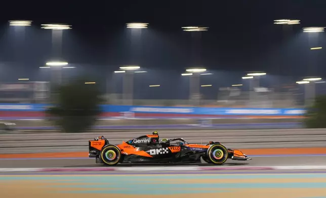 McLaren driver Lando Norris of Britain steers his car during the sprint qualifying at the Lusail International Circuit ahead of the Qatar Formula One Grand Prix, in Lusail, Qatar, Friday, Nov. 28, 2025. (AP Photo/Darko Bandic)