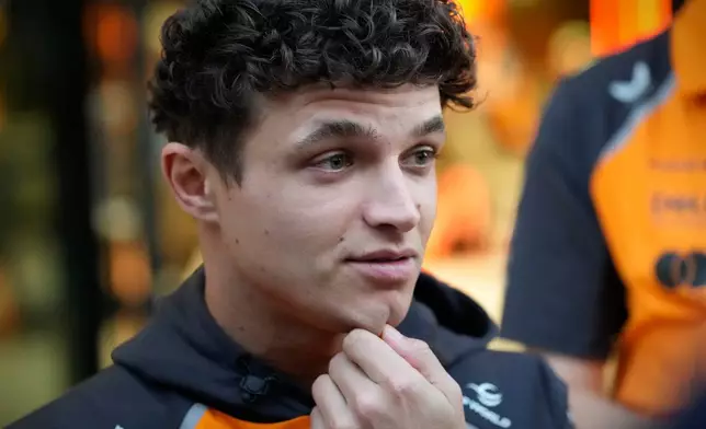 McLaren driver Lando Norris of Britain talks to the media at the Lusail International Circuit ahead of the Qatar Formula One Grand Prix, in Lusail, Qatar, Thursday, Nov. 27, 2025. (AP Photo/Darko Bandic)