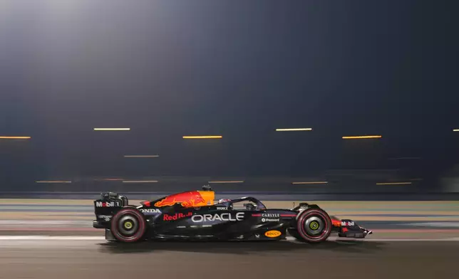 Red Bull driver Max Verstappen of the Netherlands steers his car during the sprint qualifying at the Lusail International Circuit ahead of the Qatar Formula One Grand Prix, in Lusail, Qatar, Friday, Nov. 28, 2025. (AP Photo/Darko Bandic)