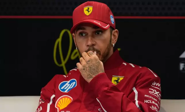 Ferrari driver Lewis Hamilton of Britain listens to a question during a press conference ahead of the Qatar Formula One Grand Prix, in Lusail, Qatar, Thursday, Nov. 27, 2025. (AP Photo/Altaf Qadri)