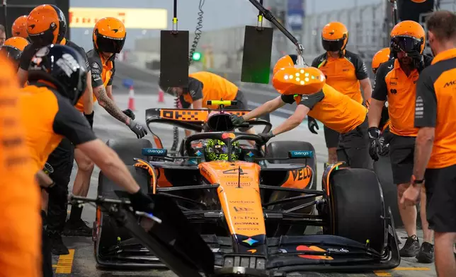 McLaren driver Lando Norris of Britain gets a pit stop during the first qualifying session at the Lusail International Circuit ahead of the Qatar Formula One Grand Prix, in Lusail, Qatar, Friday, Nov. 28, 2025. (AP Photo/Darko Bandic)