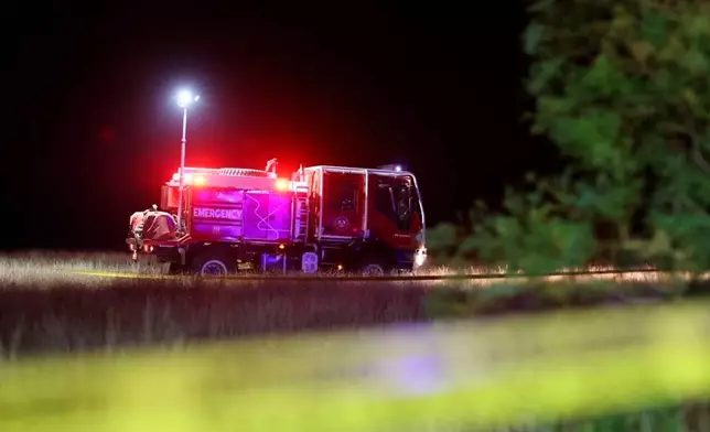 This photo released by Georgian Interior Ministry Press Service shows an emergency vehicle on a crash site of Turkish C-130 military cargo near the border between Georgia and Azerbaijan on Tuesday, Nov. 11, 2025. (Georgian Interior Ministry Press Service via AP)