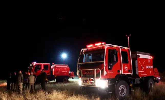 This photo released by Georgian Interior Ministry Press Service shows an emergency vehicle on a crash site of Turkish C-130 military cargo near the border between Georgia and Azerbaijan on Tuesday, Nov. 11, 2025. (Georgian Interior Ministry Press Service via AP)
