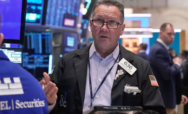 Trader Edward Curran works on the floor of the New York Stock Exchange, Monday, Nov. 24, 2025. (AP Photo/Richard Drew)