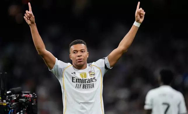 Real Madrid's Kylian Mbappe celebrates after scoring the opening goal during the Spanish La Liga soccer match between Real Madrid and Valencia in Madrid, Spain, Saturday, Nov. 1, 2025. (AP Photo/Manu Fernandez)