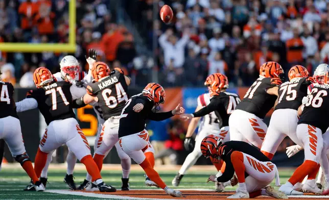 Cincinnati Bengals place kicker Evan McPherson (2) kicks a 63-yard field goal during the first half of an NFL football game against the New England Patriots, Sunday, Nov. 23, 2025, in Cincinnati. (AP Photo/Jay LaPrete)