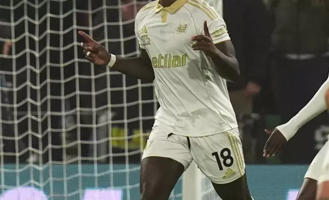 Pisa's M'Bala Nzola, center, celebrates after scoring the opening goal during the Serie A soccer match between Sassuolo Calcio and Pisa Sporting Club in Reggio Emilia, Italy, Monday, Nov. 24, 2025. (Massimo Paolone/LaPresse via AP)