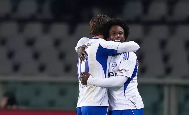 Como's Jayden Addai celebrates after scoring during the Serie A soccer match between Torino and Como, in Turin, Italy, Monday, Nov. 24, 2025. (Fabio Ferrari/LaPresse via AP)