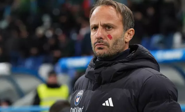 Pisa's head coach Alberto Gilardino looks on during the Serie A soccer match between Sassuolo Calcio and Pisa Sporting Club in Reggio Emilia, Italy, Monday, Nov. 24, 2025. (Massimo Paolone/LaPresse via AP)