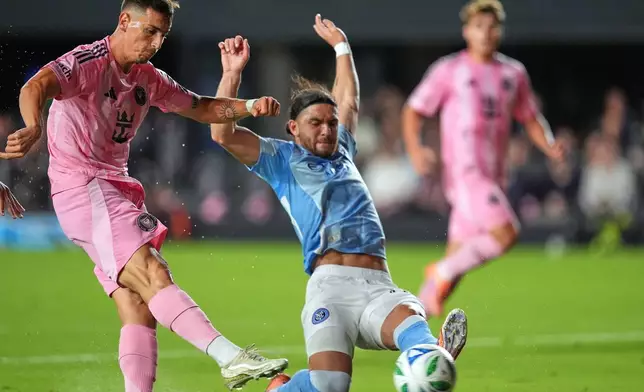 Inter Miami forward Tadeo Allende, left, scores his side's first goal past New York City FC midfielder Justin Haak during the first half of an MLS Eastern Conference final soccer match, Saturday, Nov. 29, 2025, in Fort Lauderdale, Fla. (AP Photo/Rebecca Blackwell)