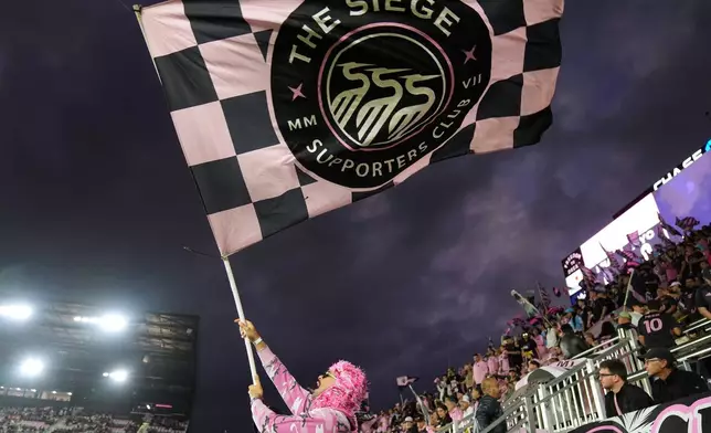 Inter Miami fans cheer at the start of an MLS Eastern Conference final soccer match against New York City FC, Saturday, Nov. 29, 2025, in Fort Lauderdale, Fla. (AP Photo/Rebecca Blackwell)