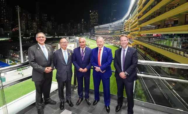 The Hon. Martin Liao, Chairman of The Hong Kong Jockey Club (2nd left); Lester Huang, Deputy Chairman of The Hong Kong Jockey Club and President of the Equestrian Federation of Hong Kong, China (1st left); Winfried Engelbrecht-Bresges, Chief Executive Officer of The Hong Kong Jockey Club (2nd right); Ingmar De Vos, President of the Fédération Équestre Internationale (centre); and Andrew Harding, Executive Director, Racing of The Hong Kong Jockey Club (1st right) attend the welcome reception of the 2025 FEI General Assembly at Happy Valley Racecourse and enjoy the stunning racecourse scenery.